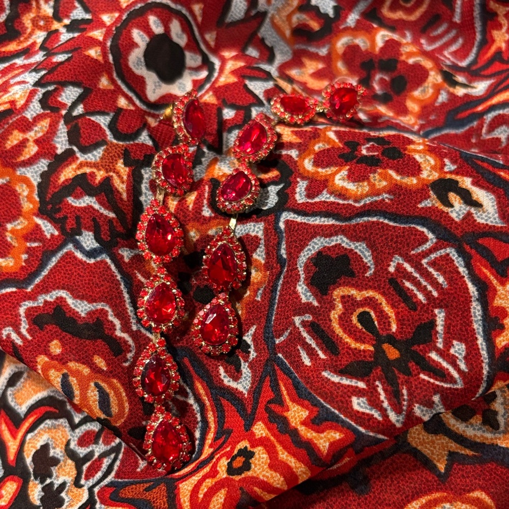Red and Orange Patterned Fabric with Red Gem Earrings